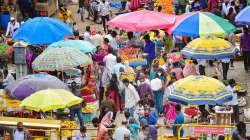 People, flouting social distancing norms, visit a crowded market as authorities eased Covid-induced lockdown relaxation in Bengaluru.