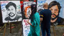 An art teacher gives finishing touch to a painting of Reuters journalist Danish Siddiqui, who was killed while covering a clash between Afghan security forces and Taliban near a border crossing with Pakistan.