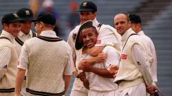 South Africa's Paul Adams receives a hug from his teammates?