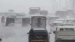 Vehicles during heavy rain shower at Western Express Highway at Kandivali in Mumbai.