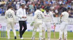 England's Joe Root, left and England's Jos Buttler exchange words with India's Jasprit Bumrah