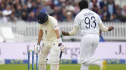 India's Jasprit Bumrah celebrates after taking the wicket of England's Joe Root