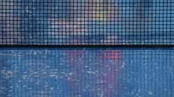 Heavy rain falls and suspends play in the second set of a match between Cameron Norrie and John Isner in the Western & Southern Open tennis tournament in Mason, Ohio, Tuesday, Aug. 17