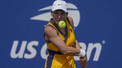 Simona Halep, of Romania, returns a shot to Camila Giorgi, of Italy, during the first round of the US Open tennis championships, Monday, Aug. 30