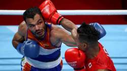 Quincy Me Okazawa (R) of Japan exchanges punches with Vikas Krishan of India