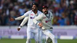 Bowler Mohammed Siraj and captain Virat Kohli of India celebrate the crucial wicket of Jos Buttler of England during the Second LV= Insurance Test Match: Day Five between England and India at Lord's Cricket Ground on August 16