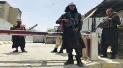 Taliban fighters stand guard at a checkpoint near the US embassy that was previously manned by American troops, in Kabul, Afghanistan on Tuesday.