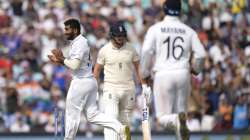 India's Jasprit Bumrah, left, celebrates taking the wicket of England's Jonny Bairstow, centre, on day five of the fourth Test match at The Oval cricket ground in London, Monday, Sept. 6