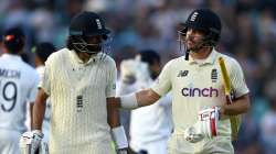 Haseeb Hameed and Rory Burns of England leave the field at stumps on day four of the Fourth LV= Insurance Test Match between England and India at The Kia Oval on September 05