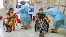 Health workers inoculate beneficiaries with the dose of the Covishield coronavirus vaccine during a special COVID-19 vaccination drive for women, in Mumbai, Friday, September 17, 2021.