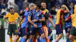 Japan players celebrate after defeating Australia in their World Cup 2022 group B qualifying soccer 