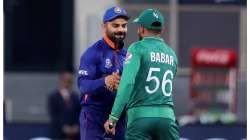 India's captain Virat Kohli, left, and Pakistan's captain Babar Azam shake hands after the toss ahead of the Cricket Twenty20 World Cup match between India and Pakistan in Dubai, UAE, Sunday, Oct. 24, 2021.