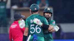 Pakistan's Mohammad Rizwan, right, celebrates after scoring half a century with captain Babar Azam during the Cricket Twenty20 World Cup match between India and Pakistan in Dubai, UAE, Sunday, Oct. 24, 2021. 