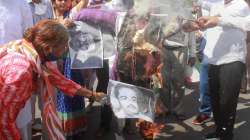 Samyukt Kisan Morcha and various social activists burn effigy of Union minister of state for home Ajay Kumar Mishra Teni, his son Ashish Mishra as they protest over the Lakhimpur Kheri incident, in Gurugram.