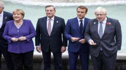 From left, German Chancellor Angela Merkel, Italian Premier Mario Draghi, French President Emmanuel Macron and British Prime Minister Boris Johnson stand at the Trevi Fountain during an event for the G20 summit in Rome.