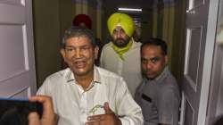 Punjab Pradesh Congress Committee chief Navjot Singh Sidhu with Congress' Punjab in-charge Harish Rawat after a meeting in New Delhi.