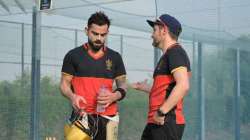 RCB skipper Virat Kohli (left) with team's Director of Cricket Operation Mike Hesson