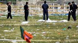 Security officials inspect at Patna's Gandhi Maidan after series of blasts during Modi's rally in 2013?