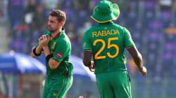 South Africa's Anrich Nortje, left, takes a catch to dismiss Bangladesh's Mahedi Hasan during the Cr