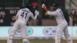 India's Shreyas Iyer, left, congratulates his teammate Ravindra Jadeja, right, after he scored a hal