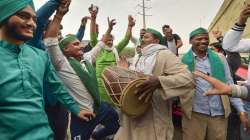 Farmers dance as they celebrate after PM Narendra Modi announced the repealing of the three farm reform laws at Ghazipur Border in New Delhi on Nov 19.