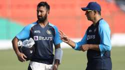 Cheteshwar Pujara gets advice from Rahul Dravid ahead of the Kanpur Test.    