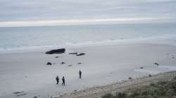 French police officers patrol on the beach in the searcher migrants in Wimereux, northern France.