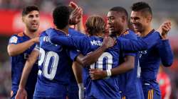 Vinicius Junior of Real Madrid celebrates with Luka Modric after scoring their side's third goal dur