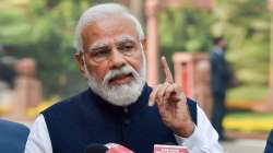 Prime Minister Narendra Modi addresses media as he arrives at Parliament to attend the Winter Session on Nov. 29, 2021.