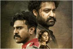 Poster of SS Rajamouli's RRR featuring Jr NTR, Ram Charan and Alia Bhatt