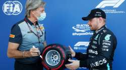  Pole position qualifier Valtteri Bottas of Finland and Mercedes GP is presented with the Pirelli Po