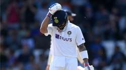 GLOOM: Virat Kohli curses himself after his dismissal during a Test Match