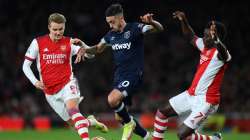 Manuel Lanzini of West Ham United takes on Martin Odegaard and Bukayo Saka of Arsenal during the Pre