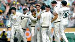 Australian cricket team celebrates after taking a wicket of England batsman. 