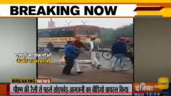 A view of SP workers?vandalising a car with BJP flag in Kanpur on Tuesday.?