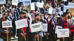 Locals stage a protest demanding repeal of Armed Forces (Special Powers) Act in Kohima on Friday, Dec. 17, 2021.