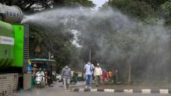 A BBMP vehicle sprays disinfectant in front of Vidhana Soudha in view of possible spread of Covid-19 variant Omicron, in Bengaluru.