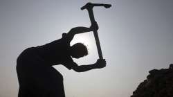 A labourer works at a pottery workshop on the outskirts of Karachi, Pakistan.