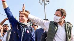 Congress leaders Rahul Gandhi and Priyanka Gandhi Vadra wave at supporters as they take part in the 'Manhgai Hatao, BJP Bhagao Pratigya Padyatara', in Amethi on Dec 18.