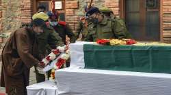 A relative pays tribute to Rameez Ahmad, who was killed in a militant attack last night at Zewan, during a ceremony at District Police Lines, in Srinagar, Tuesday