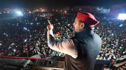 Samajwadi Party President Akhilesh Yadav speaks during his Vijay Rath Yatra ahead of 2022 Uttar Pradesh Assembly elections, in Unnao.