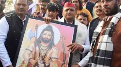 Samajwadi Party chief Akhilesh Yadav holds a portrait of Lord Parashuram at the newly constructed Lord Parashuram temple at Mahurakalan village near Purvanchal Expressway, in Lucknow, Sunday, Jan. 2, 2022.?