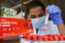 A health worker conducts Covid-19 tests at a hospital, in Thane