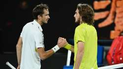 Stefanos Tsitsipas of Greece and Daniil Medvedev of Russia embrace at the net following their Men's 