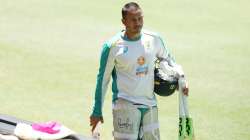 Usman Khawaja walks from the field after batting during an Australian nets session.