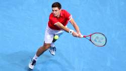 Kamil Majchrzak of Poland plays a backhand during a match