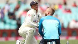 Jos Buttler of England receives medical attention to his fingers during day two of the Fourth Test