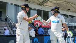 Will Young and Tom Latham of New Zealand walk out to bat during day one of the Second Test