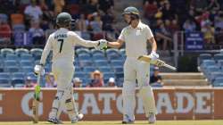 Australia women's Rachael Haynes (left) is congratulated by captain Meg Lanning after reaching her h