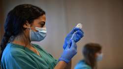 A medical staff member prepares a dose of the Moderna COVID-19 vaccine, at San Pedro Hospital in Logrono, northern Spain.